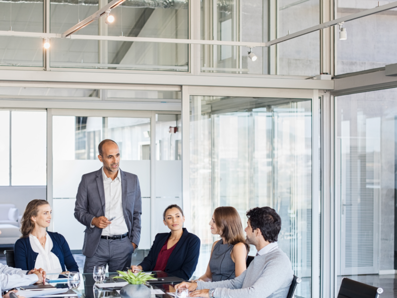 Leadership team in a boardroom displaying emotional intelligence